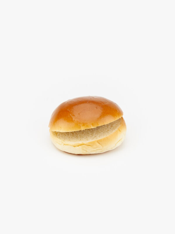 A 4" brioche burger bun sliced