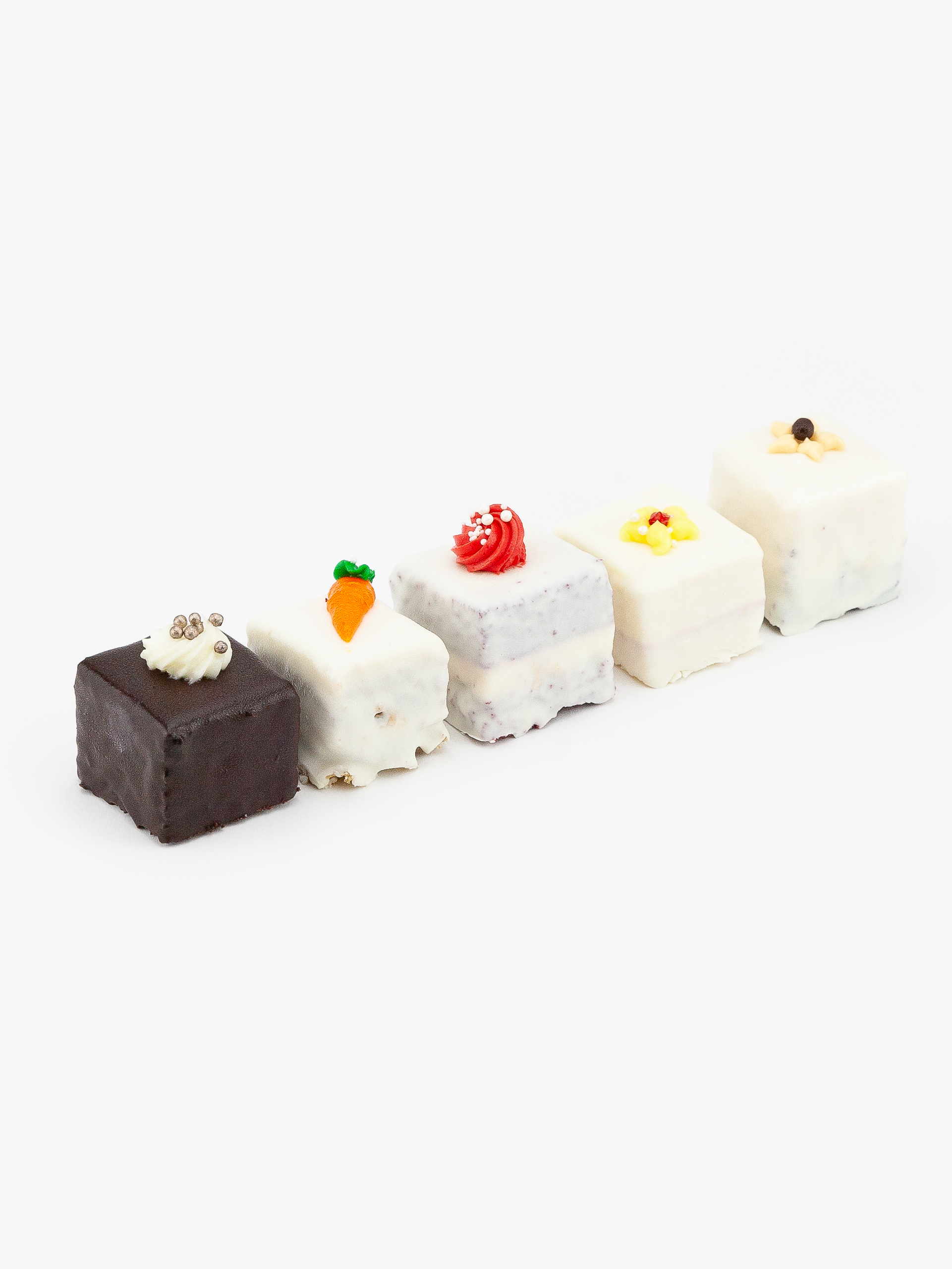 A Selection of 5 Mini Cakes on a light grey background