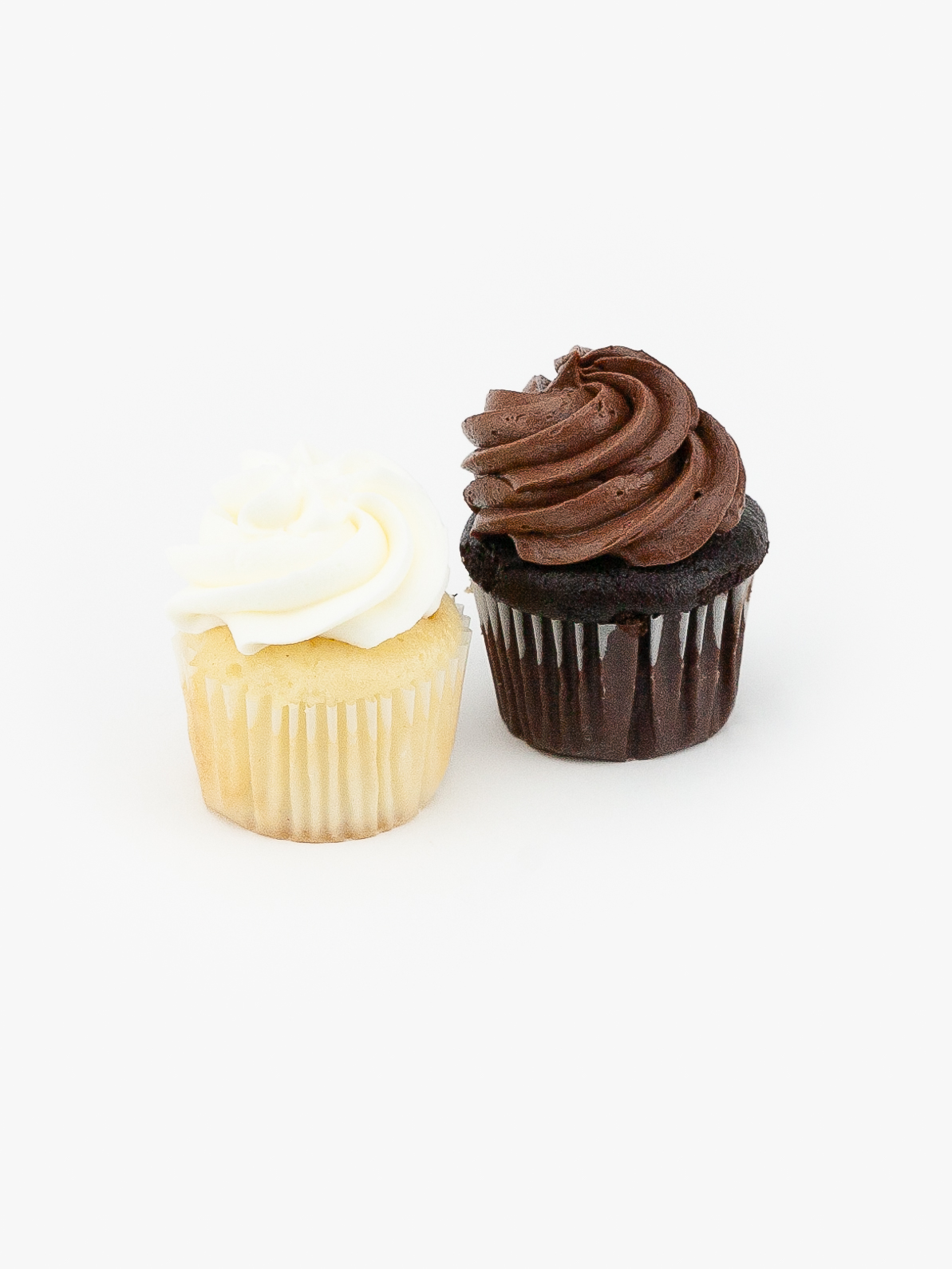 Chocolate and Vanilla Mini Dessert Cupcakes in wrapping on a light grey background