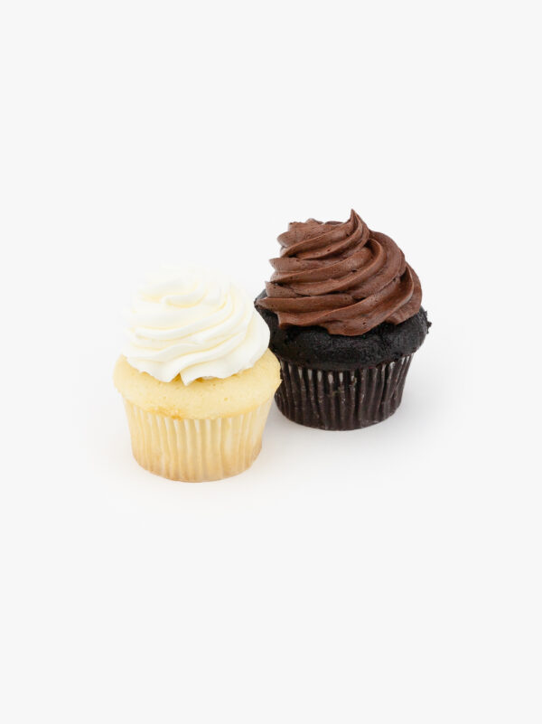 2 Regular Assorted Dessert Cupcakes in wrapping on a light grey background