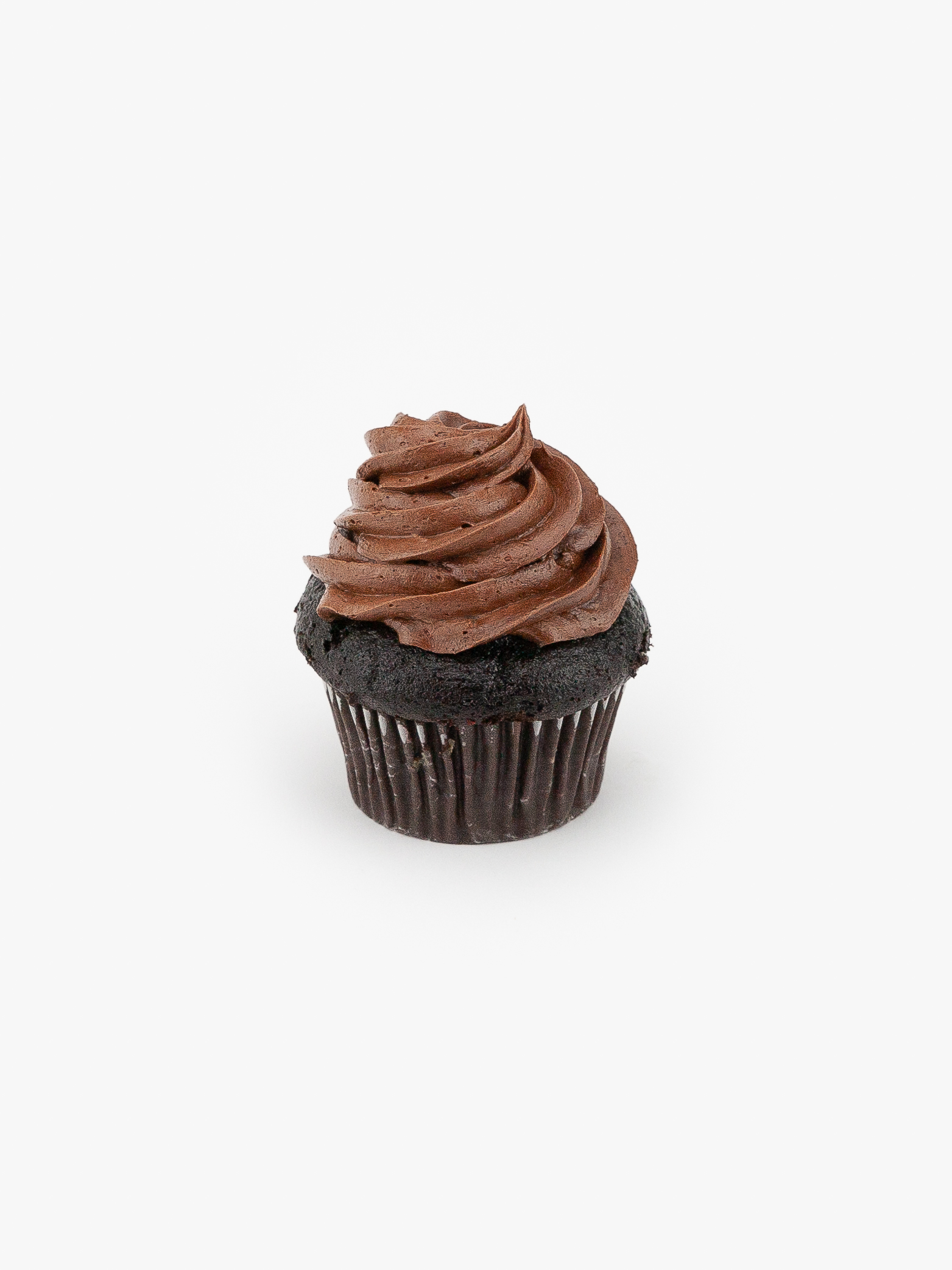 A Single Regular Chocolate Dessert Cupcake in wrapping on a light grey background