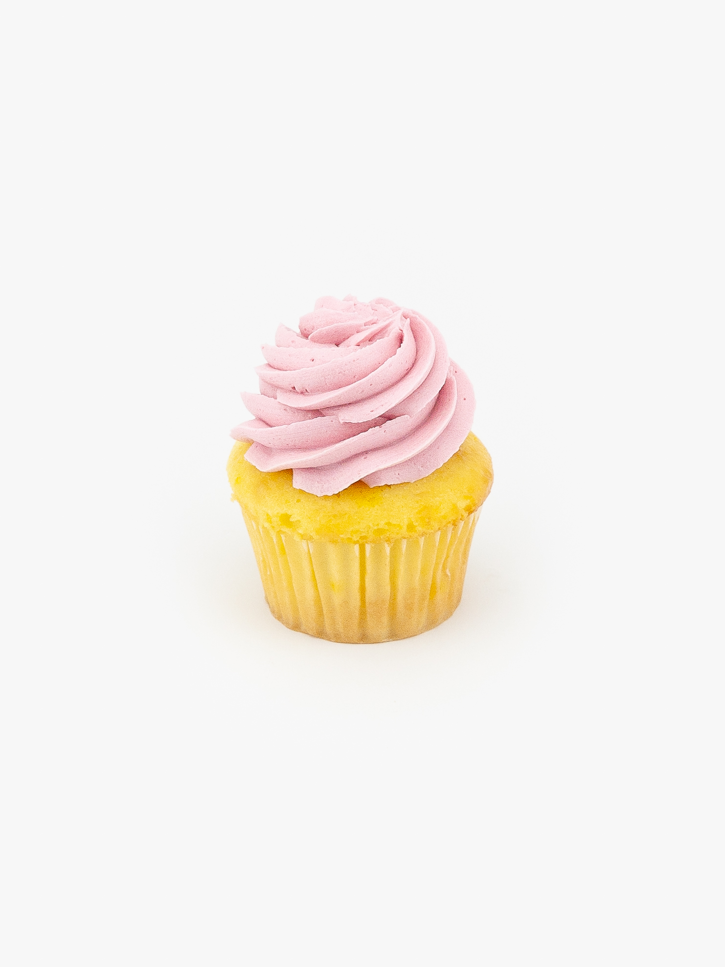 A Single Regular Lemon Raspberry Dessert Cupcake in wrapping on a light grey background