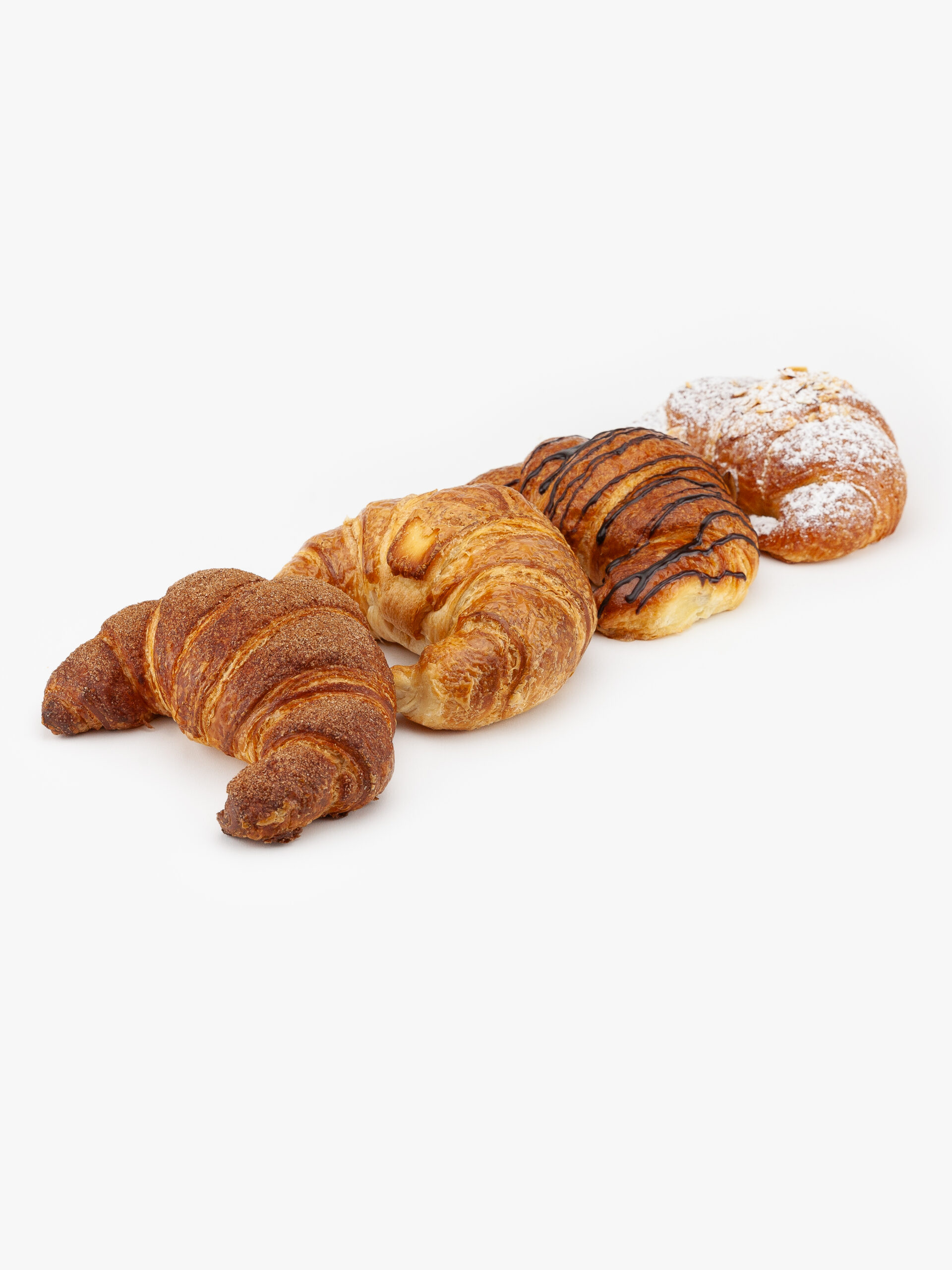 An Assortment of 4 Jumbo Curved Croissants, Churro, Almond, Chocolate and Butter on a light grey background