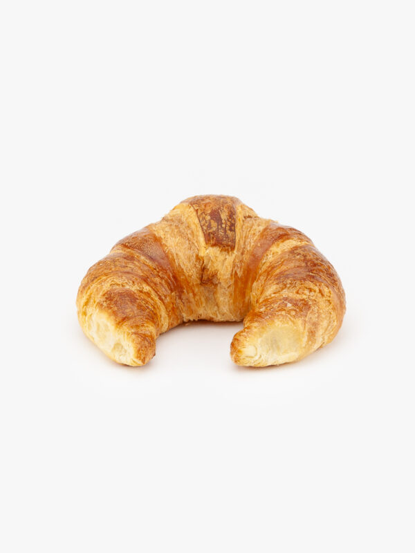 A Single Curved Jumbo Butter Breakfast Croissant on a light grey background