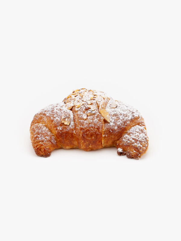 A Single Curved Jumbo Almond Breakfast Croissant on a light grey background