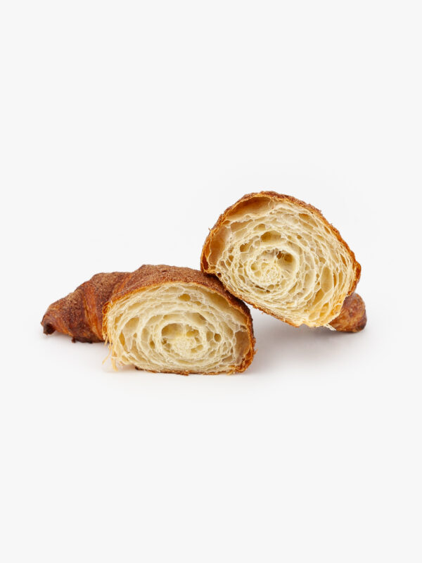 Curved Jumbo Churro Breakfast Croissant Cut Open on a light grey background