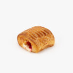 A Single Rectangular Mini Guava Cheese Croissant perfectly baked on a light grey background