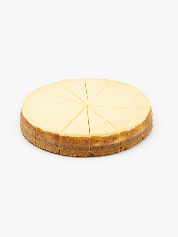 A Single 10" Round New York 14 Cut Cheesecake individually sectioned on a light grey background