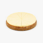 A Single 10" Round New York 16 Cut Cheesecake individually sectioned on a light grey background