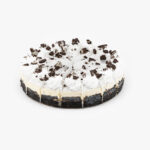 A Single 10" Round Cookies and Cream 16 Cut Cheesecake individually sectioned on a light grey background