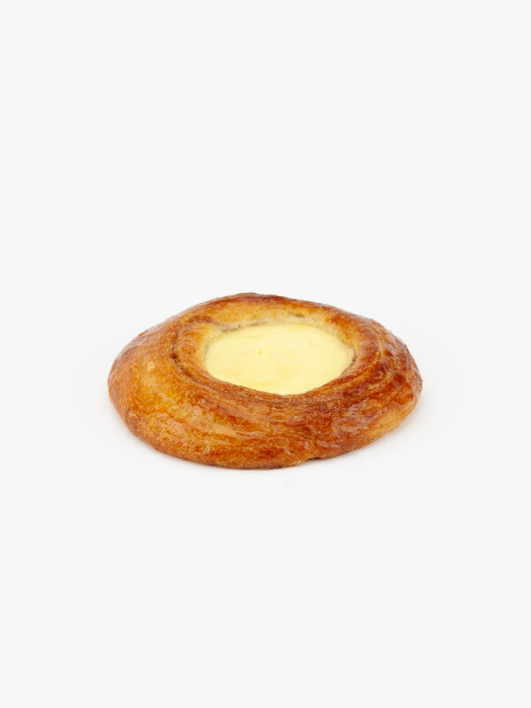 A Jumbo Round Custard Breakfast Danish perfectly baked on a light grey background