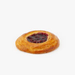 A Jumbo Round Cherry Breakfast Danish perfectly baked on a light grey background