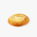 A Jumbo Round Apple Breakfast Danish perfectly baked on a light grey background