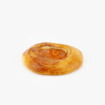 A Jumbo Round Apricot Breakfast Danish perfectly baked on a light grey background