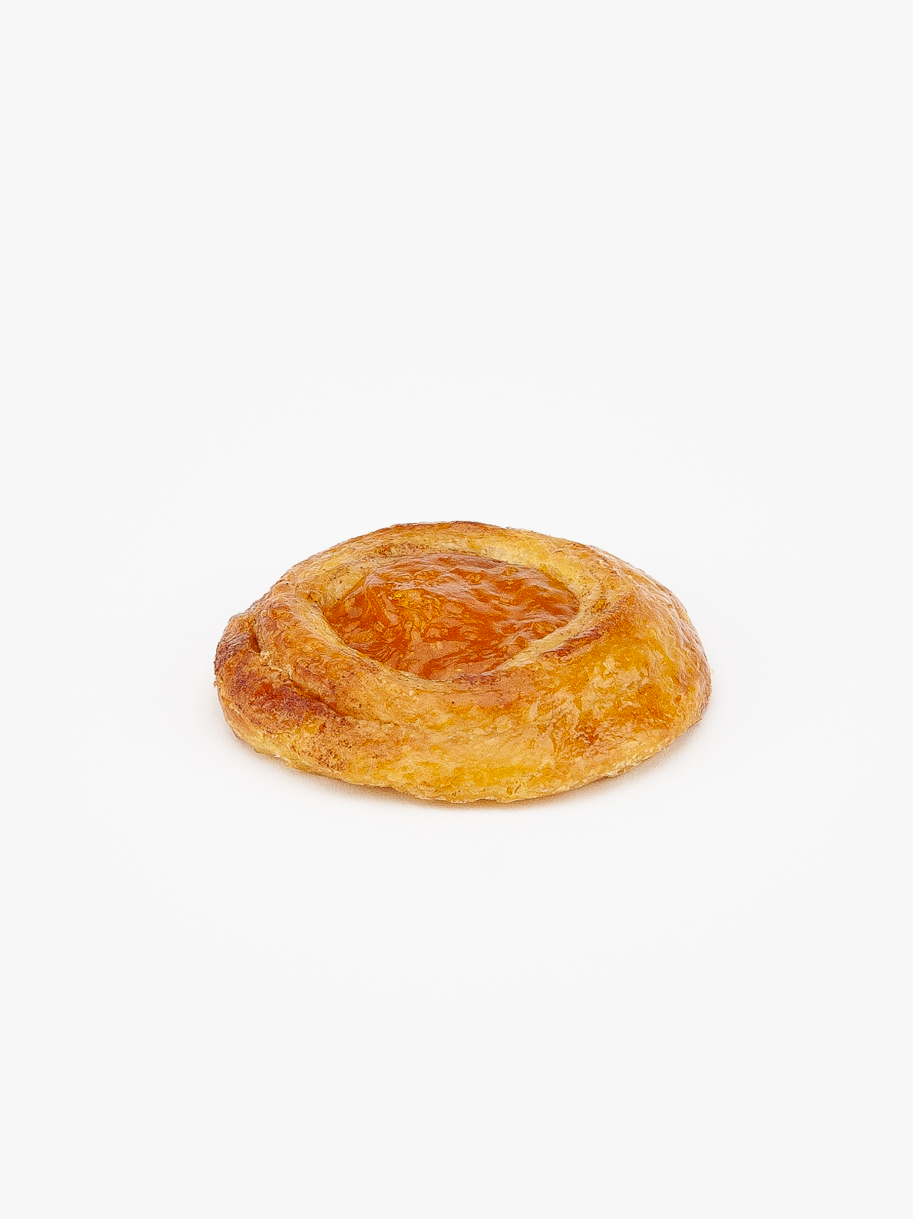 A Mini Round Apricot Breakfast Danish baked perfectly on a light grey background