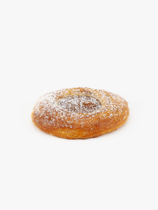 A Single Jumbo Round Dulce De Leche Danish with icing sugar on a light grey background