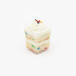 A Single Regular Confetti Dessert Parfait Cup on a light grey background