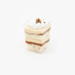 A Single Regular Dulce De Leche Dessert Parfait Cup on a light grey background