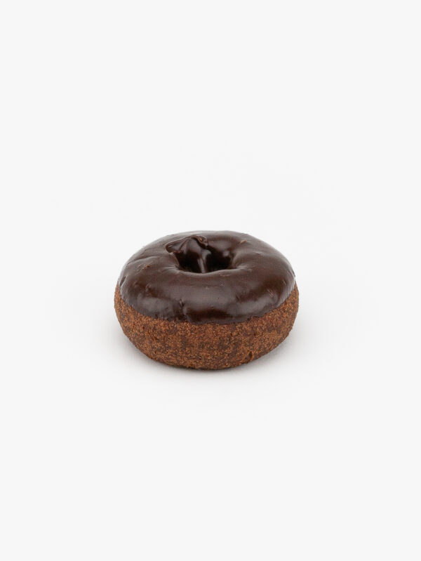 A Regular Chocolate Cake Donut on a light grey background