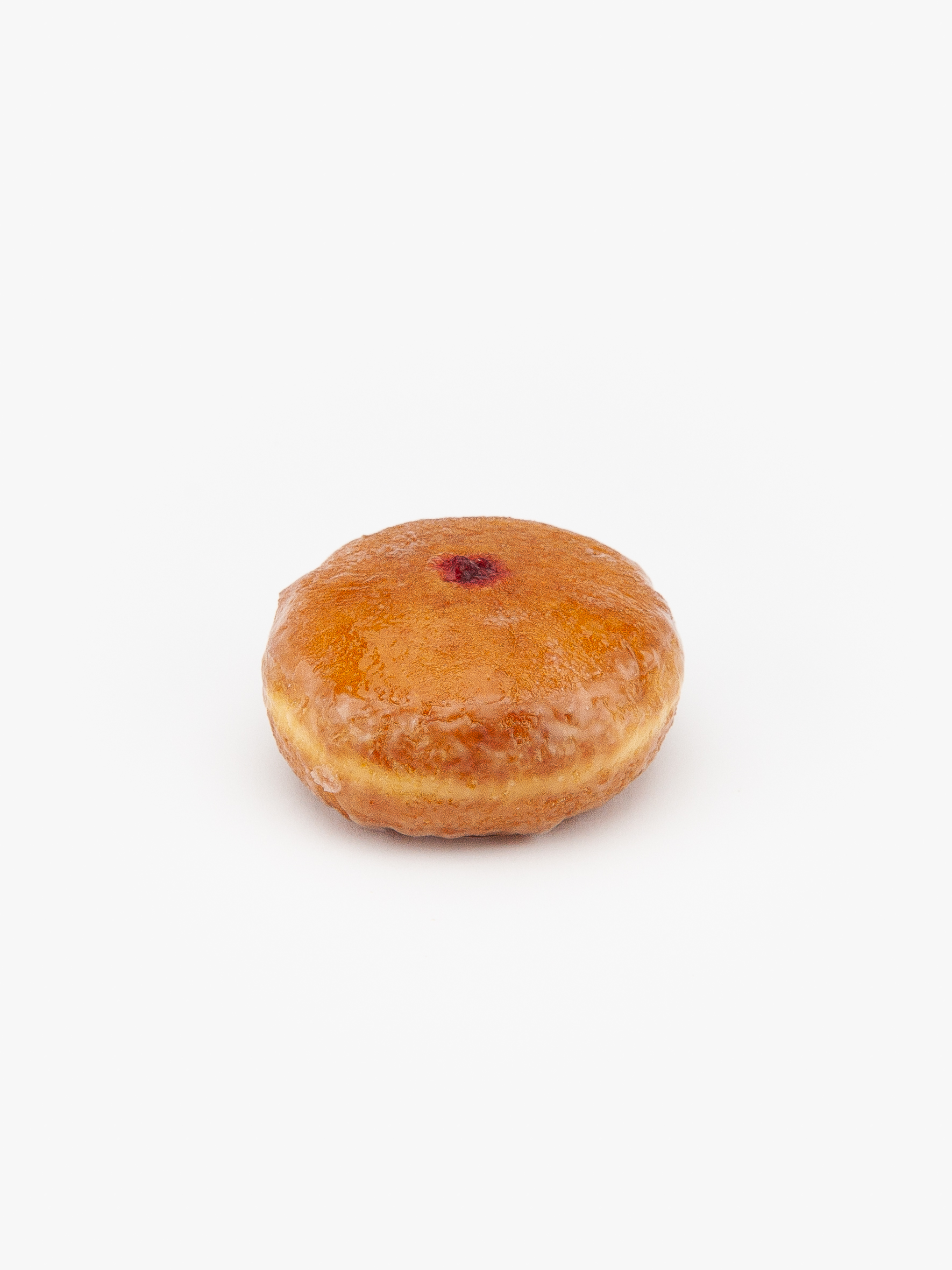 A Regular Raspberry Filled Donut on a light grey background