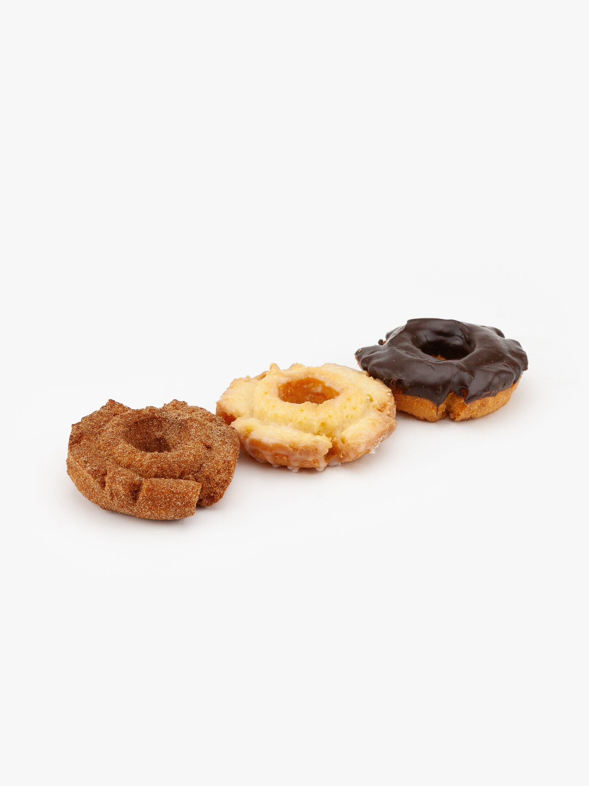 An assortment of 3 old fashioned regular donuts