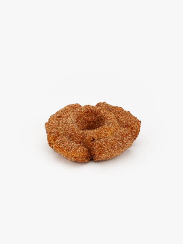 An Old Fashion Churro Regular Donut on a light grey background