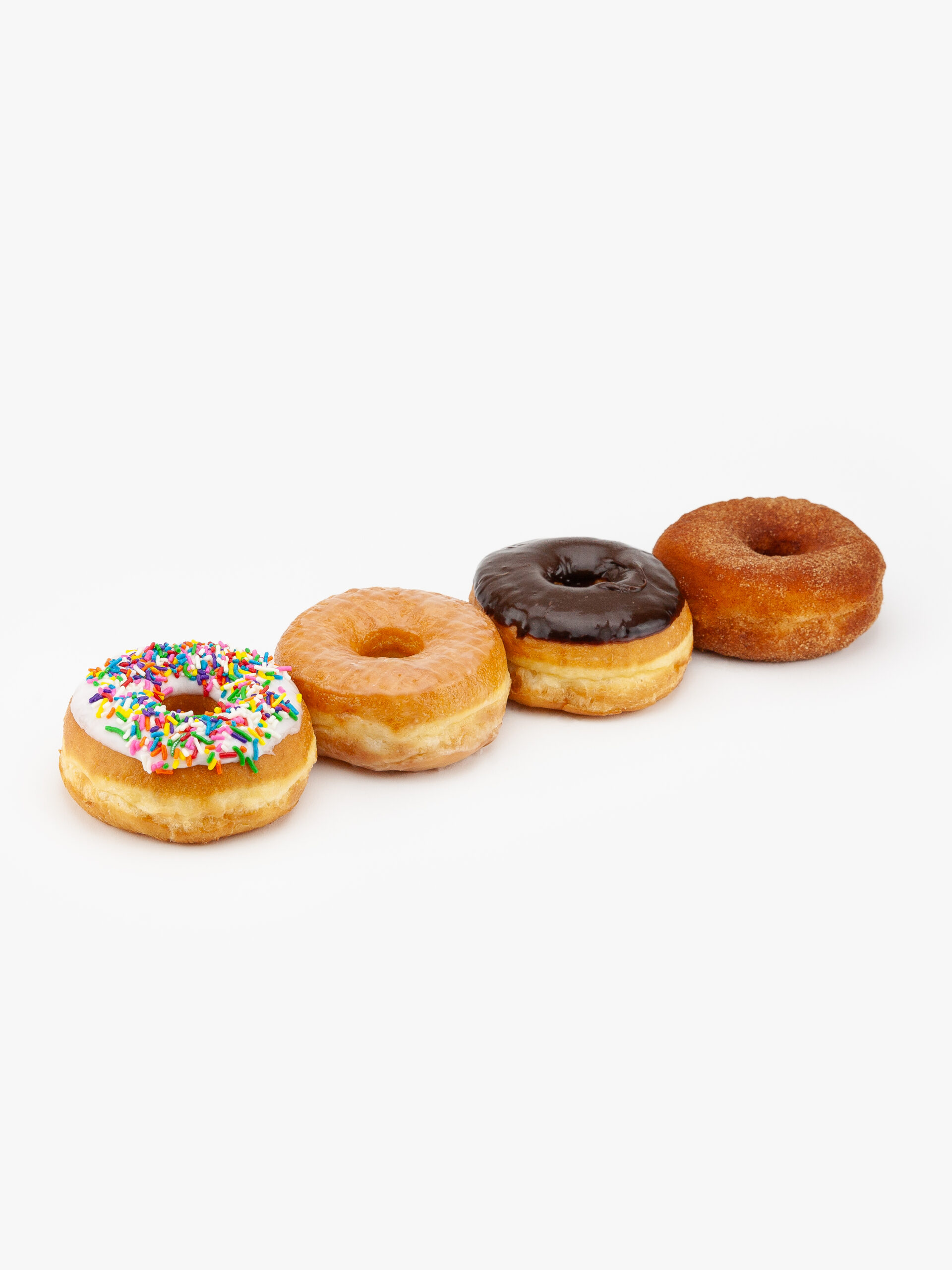 An assortment of 4 regular raised donuts