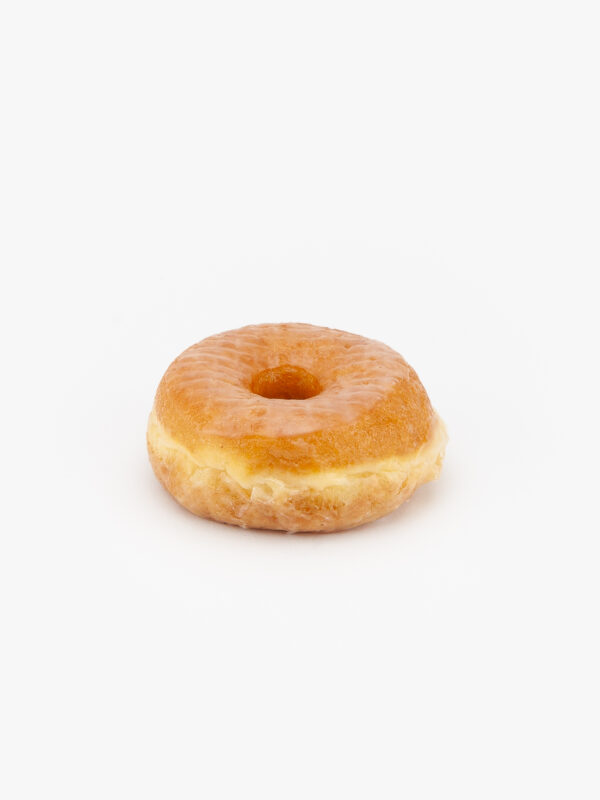 A Regular Raised Glazed Donut on a light grey background