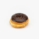 A Regular Raised Chocolate Donut on a light grey background