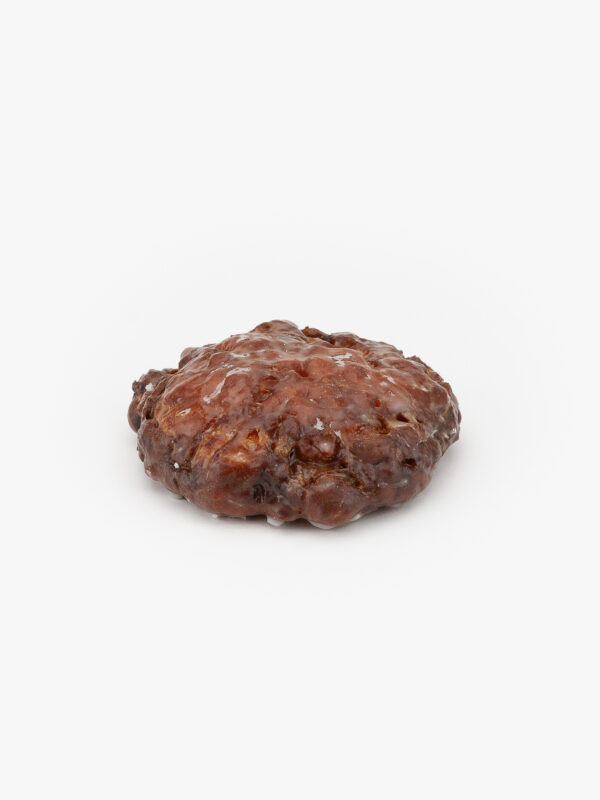 A Specialty Apple Fritter Donut on a light grey background