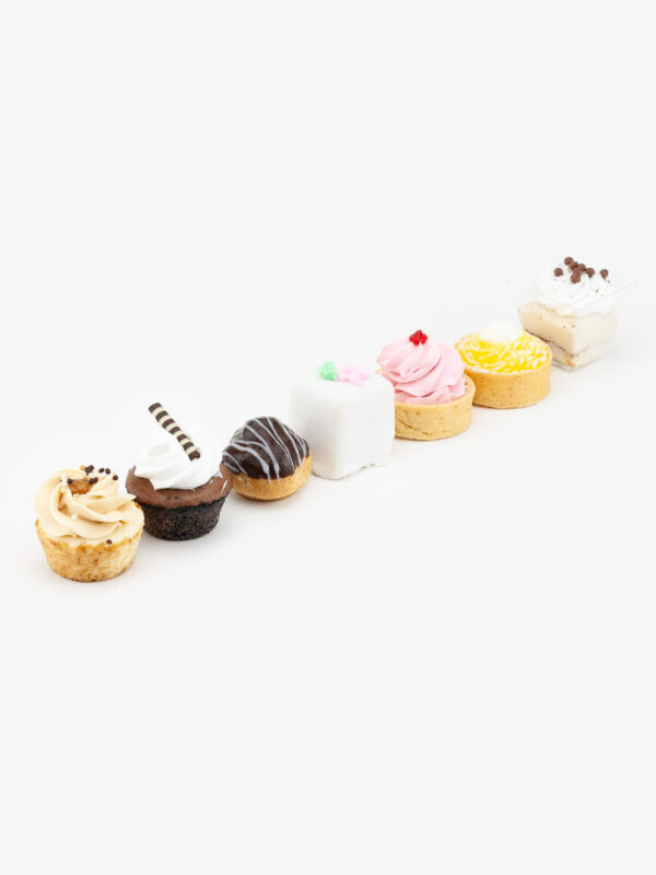 7 Assorted Mini Dessert Pastries on a light grey background