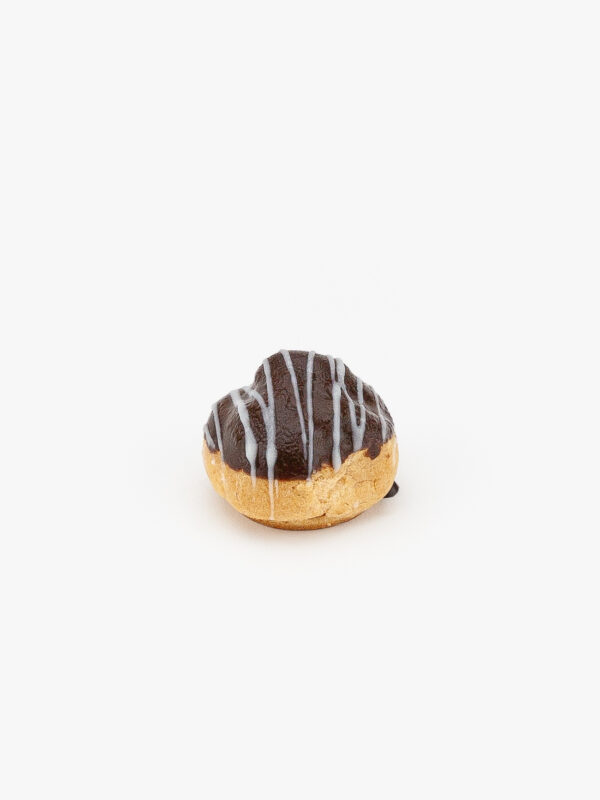 A Mini Cream Puff Dessert Pastry on a light grey background