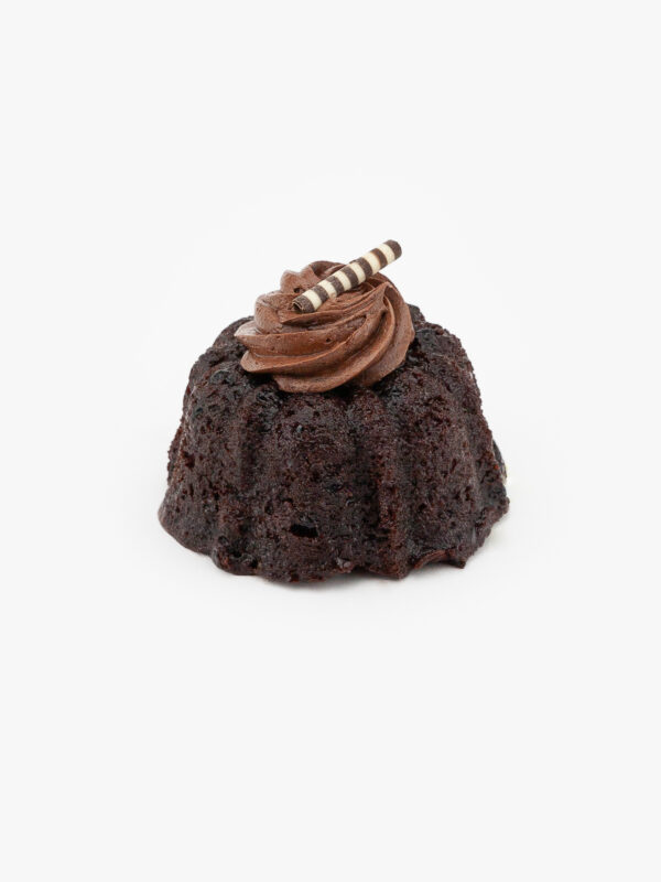 A Single 3" Chocolate Bundt Cake Dessert Pastry with icing on a light grey background