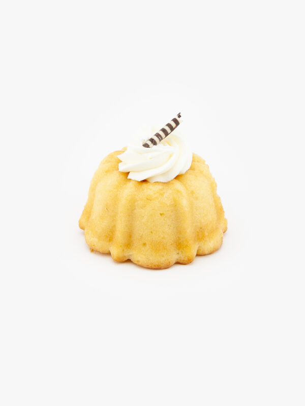 A Single 3" Vanilla Bundt Cake Dessert Pastry with icing on a light grey background