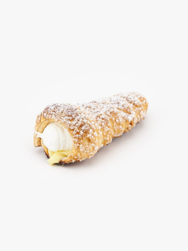 A Single Custard Cream Regular Horn Dessert Pastry with icing sugar on a light grey background