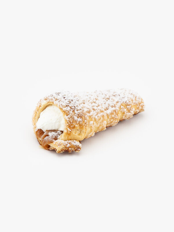 A Single Dulce De Leche Regular Horn Dessert Pastry with icing sugar topping on a light grey background