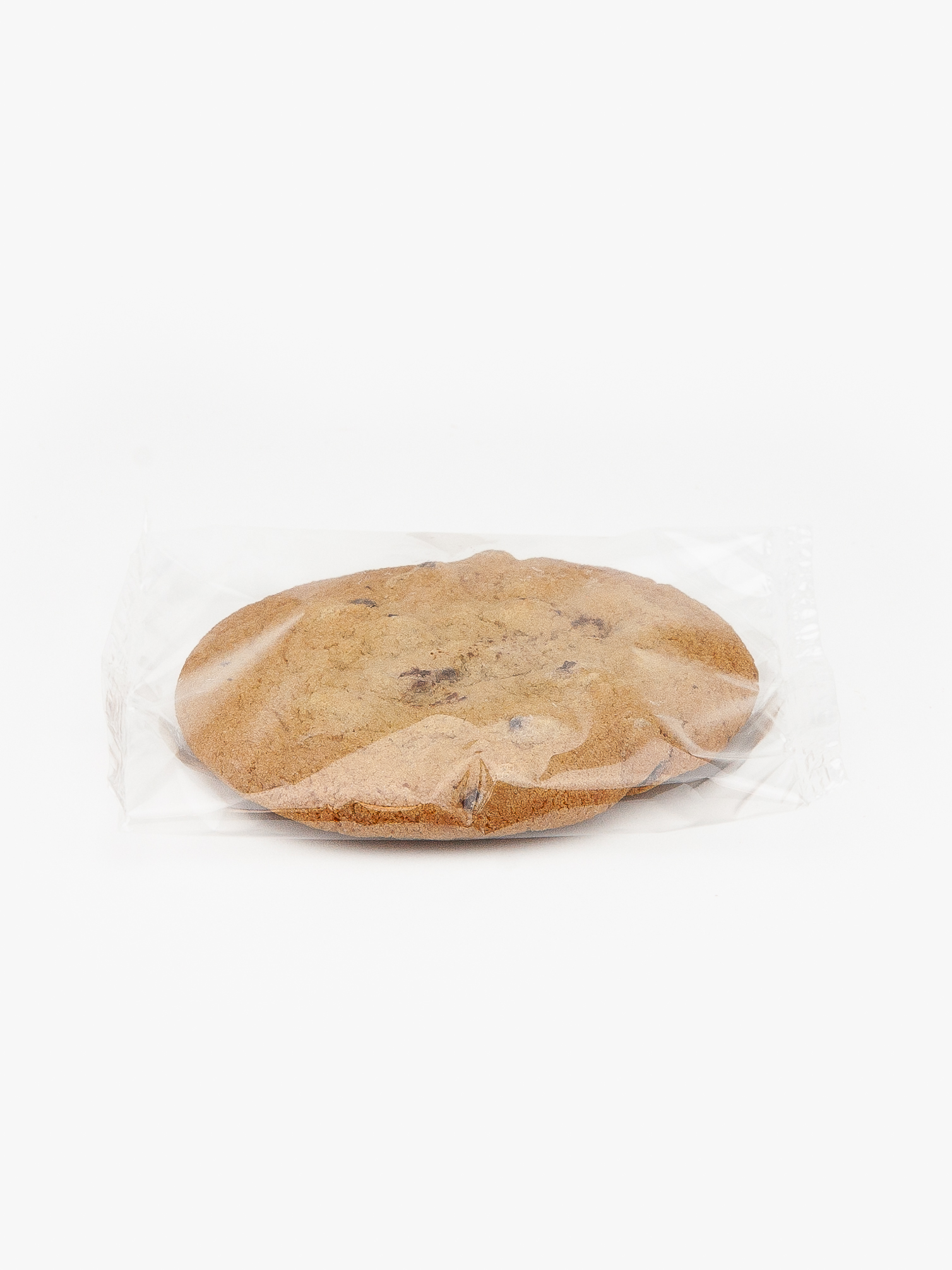 A Single Individual Wrapped Jumbo Chocolate Cookie Sealed in Plastic on a light grey background