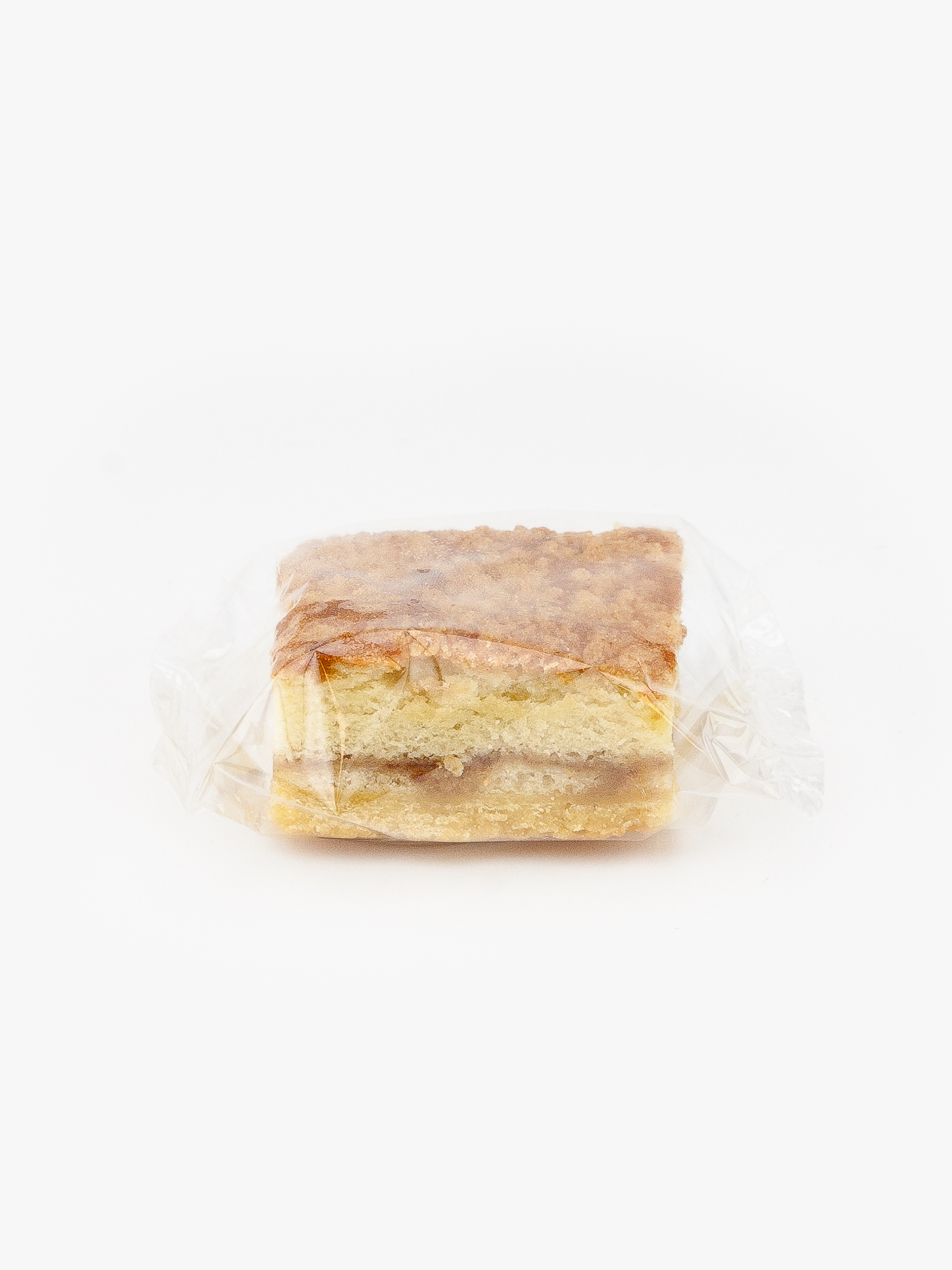 A Single Individual Wrapped Coffee Cake Plain Bagel Sealed In Plastic on a light grey background