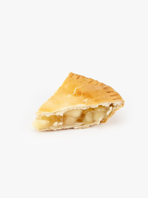 A slice of Baked Apple Pie on a light grey background