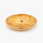 A 10" Baked Cherry Pie no cut on a light grey background