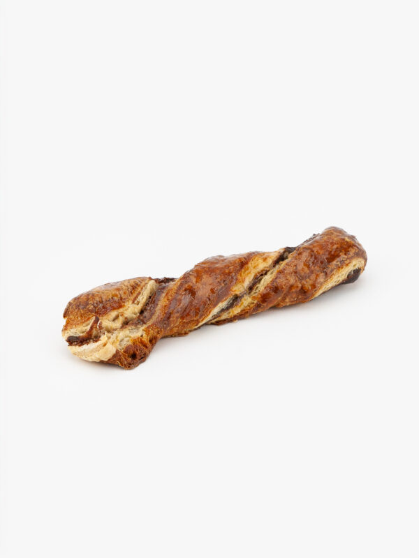 A Single Jumbo Cinnamon Twist Sweet Roll on a light grey background