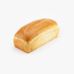 Loaf of 32 oz. Brioche Sandwich bread no slice on a light grey background