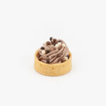 A Chocolate Mousse Mini Dessert Tart on light grey background