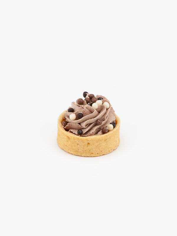 A Chocolate Mousse Mini Dessert Tart on light grey background