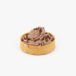 A Chocolate Mousse Individual Dessert Tart on a light grey background.