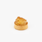 A Spiced Apple Mini Dessert Tart on light grey background