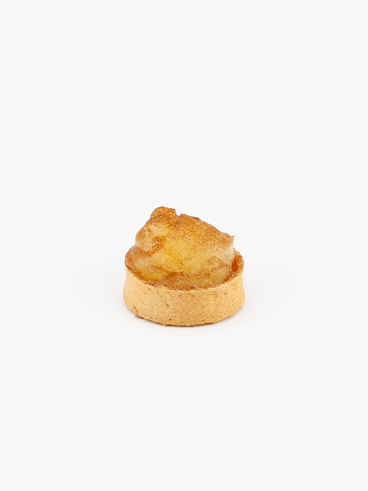 A Spiced Apple Mini Dessert Tart on light grey background